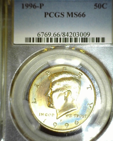 1996 P Kennedy Half Dollar slabbed "PCGS MS66".