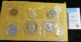 1963 Five-piece U.S. Proof Set, coins are loose with original cellophane.