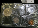 1960 P Cent, Dime, and Franklin Half Dollar loose in U.S. Mint cellophane. Some toning.