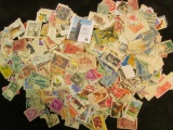 Large group of Several hundred U.S. and Foreign Postage Stamps. All appear to be cancelled.
