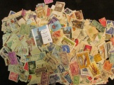 Large group of Several hundred U.S. and Foreign Postage Stamps. All appear to be cancelled.