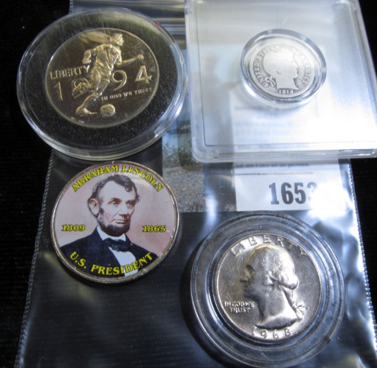 Kennedy Half Dollar with Lincoln's Head sticker on it; 1912 D Barber Dime in a Snaptight case; 1994