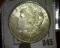 1921 P Gem BU, lightly toned Morgan Silver Dollar.