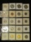 Mixture of (20) Coins ranging in denominations up to Dollar in a 20 pocket plastic page. Includes Si