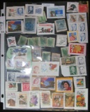 (55) old U.S. Stamps in a plastic page.