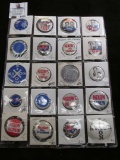 Collection of Richard Nixon Pin-backs and memorabilia in a 20-pocket plastic page.