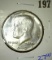 1982-D Kennedy half dollar with the designer's initials missing