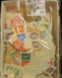 Large group of old postage stamps, most of which appear to be Canadian.