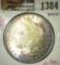 1897 Morgan Dollar, BU toned, MS63 value $75, MS65 value $330