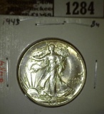 1943 Walking Liberty Half, BU, value $50