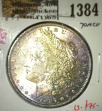 1897 Morgan Dollar, BU toned, MS63 value $75, MS65 value $330