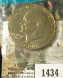 1976 Eisenhower Dollar, type 1 (1975), still in Mint Cello, BU, value $10+