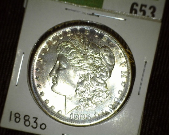 1883 O Morgan Silver Dollar. Lovely toned Brilliant Uncirculated.