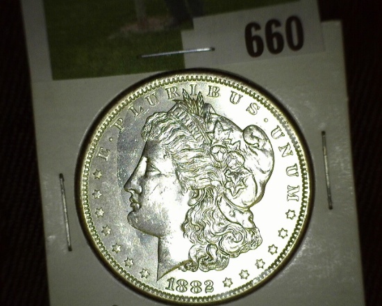 1882 O/O Morgan Silver Dollar. Brilliant Uncirculated with repunched Mint Mark.