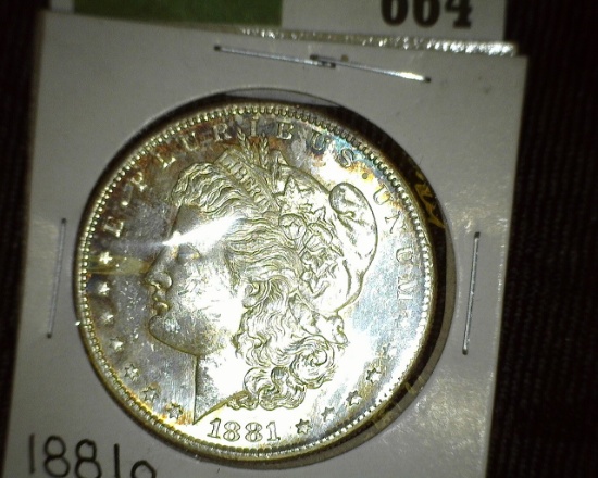 1881 O Morgan Silver Dollar. Brilliant Uncirculated with lovely natural toning.