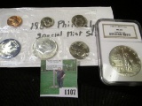 1965 U.S. Special Mint Set in cellophane and 1986 P Statue of Liberty Silver Dollar slabbed MS 69 by