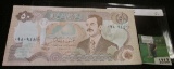 Central Bank of Iraq Fifty Dinars Banknote depicting Saddam Hussein.