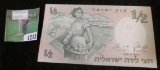 1958 Israel Half Shequel Banknote depicting Woman gathering apples. Official watermark. Excellent co