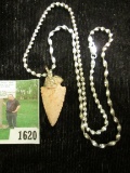 Native American Flint Arrowhead mounted (rather crudely) on a Sterling Silver Chain.