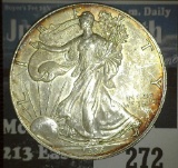 1996 Scarce Date .999 Fine Silver American Eagle Dollar. Lightly toned.