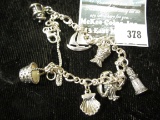 Nautical themed sterling charm bracelet w/7 charms, 27.4g