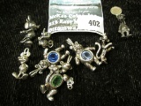 Group of 9 Disney licensed sterling charms, includes Mickey Mouse, Dumbo, Winnie the Pooh, Tigger an