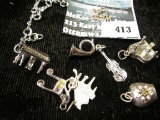 Group of 8 sterling musical charms, 1 attached to small charm bracelet, 20.5g