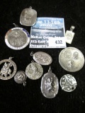 Group of 10 sterling religious medals and charms, all marked sterling, 79.2g