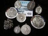 Group of 9 sterling religious medals and charms, all marked sterling, 65.2g