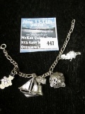 Vintage sterling charm bracelet w/5 charms including snowman, sailboat, liberty bell and globe, 18.3