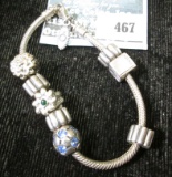 Pandora bracelet w/8 charms, 34.9g
