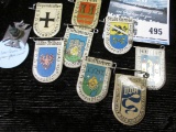 8 Germany city pins w/arms and 1 German silver cross w/green glass insert, circa 1920-1930