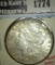1889 Morgan Dollar, BU toned, MS63 value $65, MS64 value $80, MS65 value $165