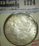 1889 Morgan Dollar, BU toned, MS63 value $65, MS64 value $80, MS65 value $165