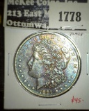 1891 Morgan Dollar, AU toned, value $45