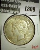 1923-D Peace Dollar, AU, value $40