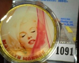 Large encapsulated Marilyn Monroe Medal, depicted on one side nude in gleaming gold and on the other