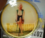 Large encapsulated Marilyn Monroe Medal, depicted on one side nude in gleaming gold and on the other