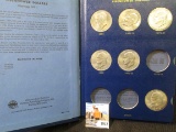 1971-74 Partial Set of Eisenhower Dollars in a Deluxe Whitman Album. (6 clad & 2 Silver).