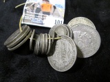 A heavy string of 4.37 ounces of .500 fine Silver Coins. All holed, a few with multiple holes and mo