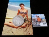 1923 S U.S. Peace Silver Dollar & a postcard titled 