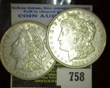 Pair of 1921 P Morgan Silver Dollars, both EF or better.