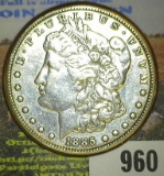 1885 P Morgan Silver Dollar mounted in a steel bezel.