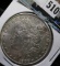 1900 P Morgan Silver Dollar.