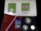 2004 P & D Sacagawea Dollar Set with Stamp in display card; & 1976 S Three-piece Silver Proof Set.