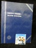 Empty Blue Whitman Folder for Silver Dollars.