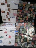 Large Selection of U.S. and Foreign Stamps, some still on paper.