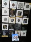 Mixed Assortment of Foreign Coins including a 1963 Canada Silver Dollar in a heavily PVC damaged pla