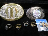 (2) Western Style Belt Buckles and several rings.