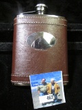 Whiskey Flask with leather cover.